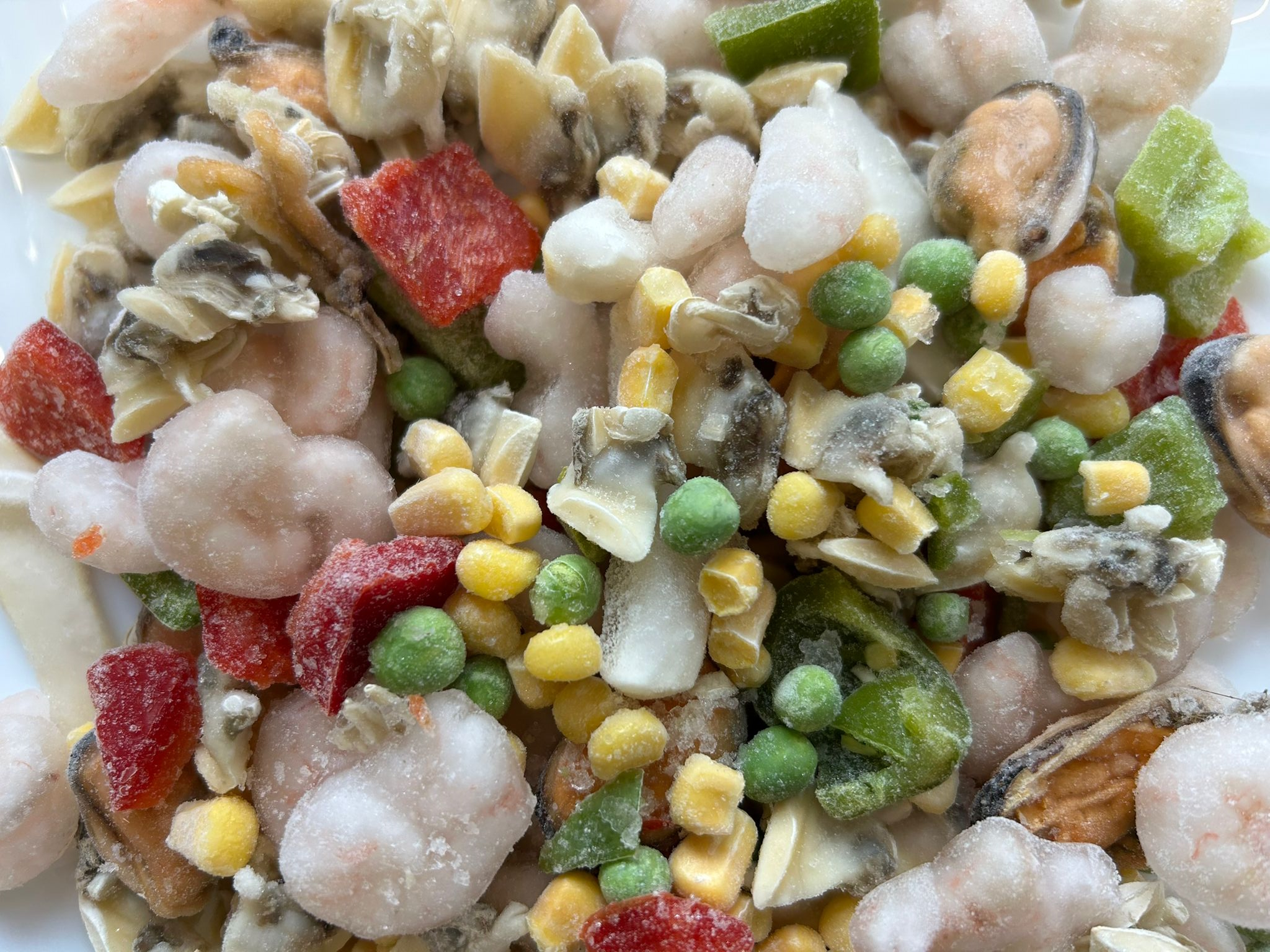 Paella Mix mit MeeresfrüchtenMais, Erbsen und Paprika